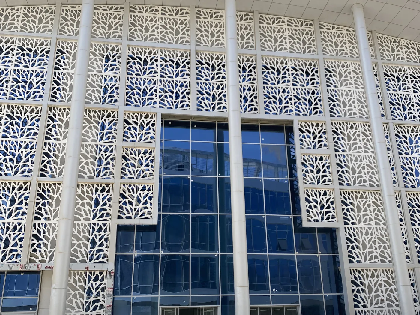Suez Hospital — perforated screen panels forming the façade