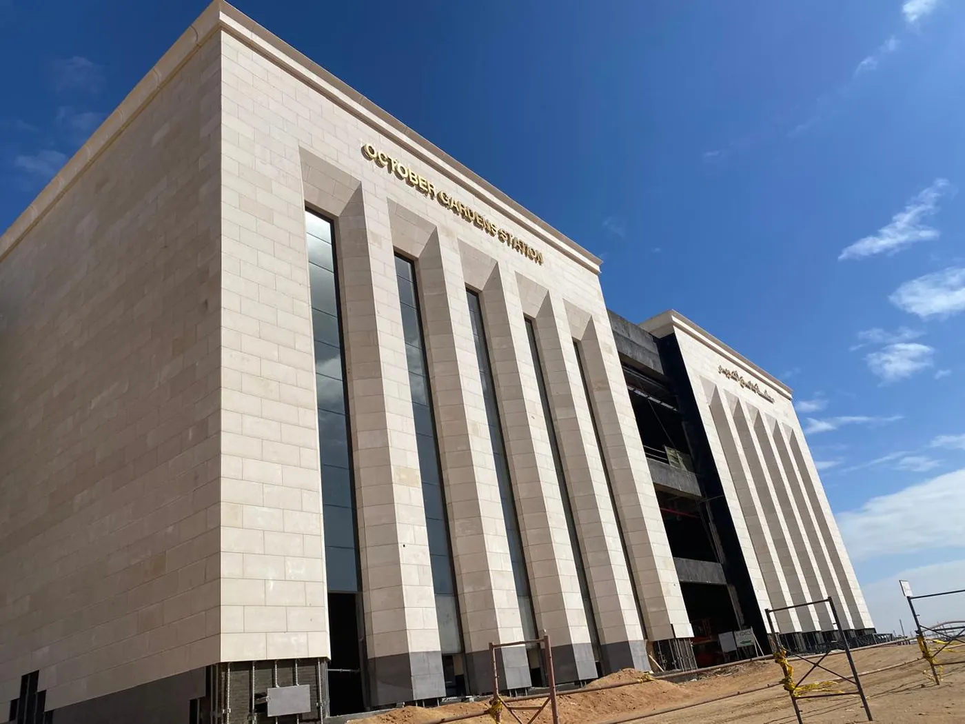 Hadayek October Metro Station — large-format stone cladding with deep vertical fins