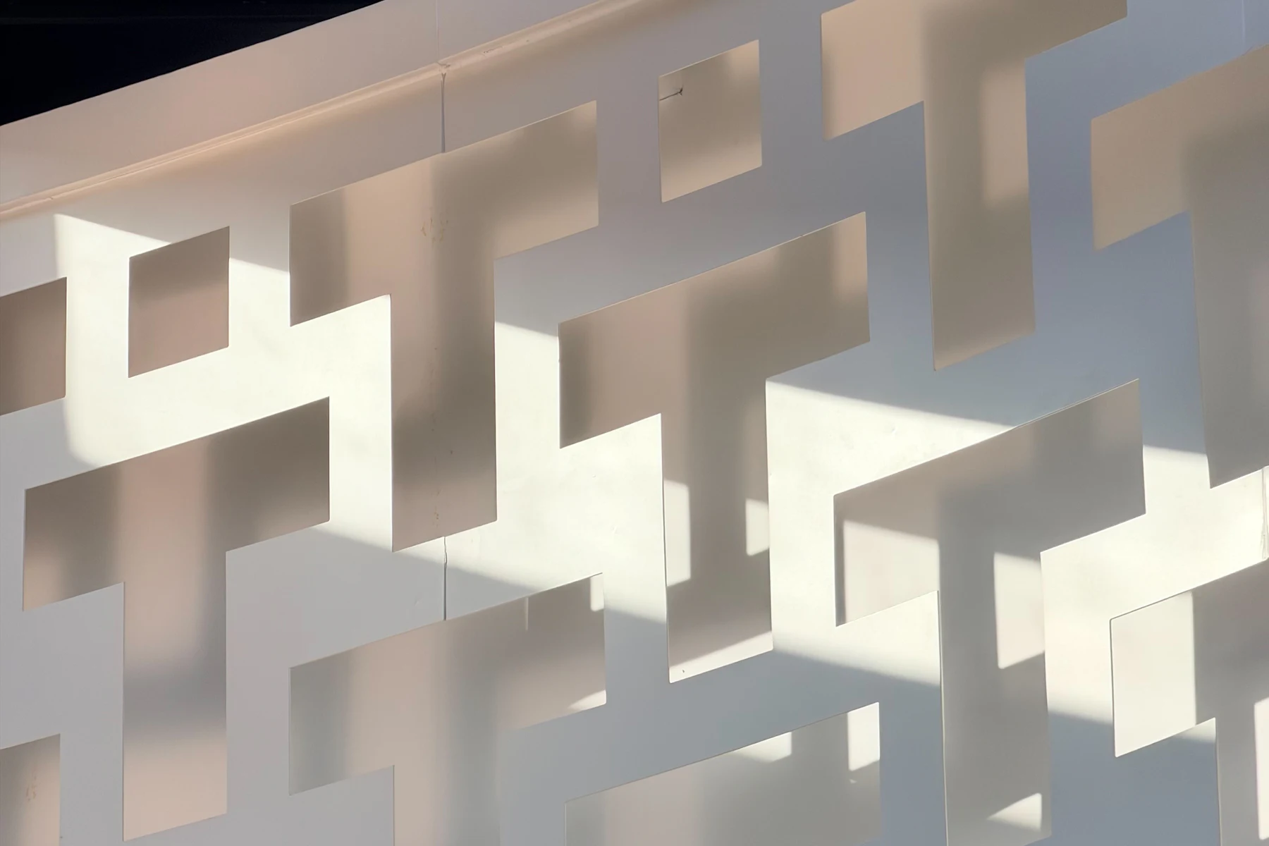 Sculpted relief wall built from interlocking cast blocks