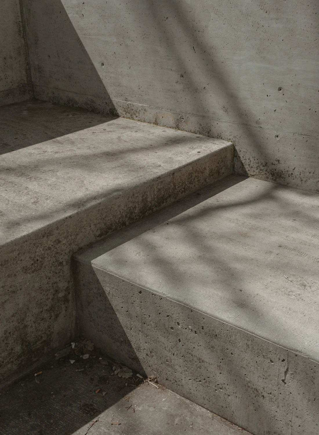 Cast concrete stair with sharp raking shadow