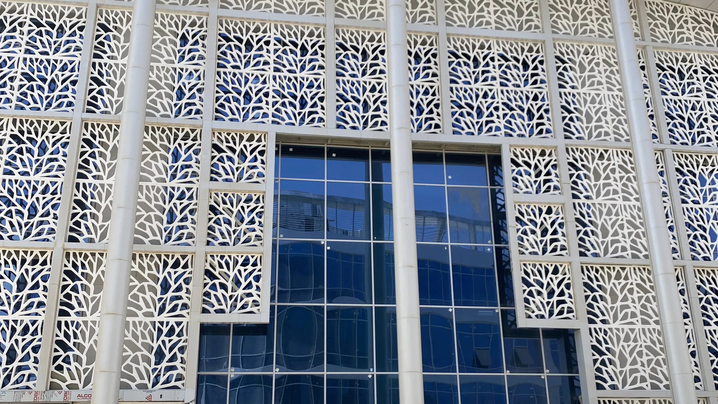 Perforated screen façade at Suez Hospital, produced by MarmoFiber