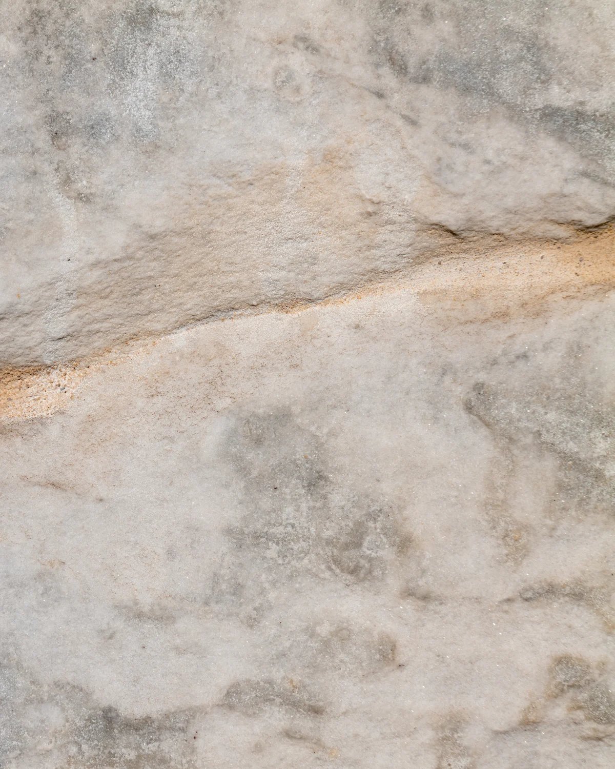 Warm mineral stone surface with natural movement
